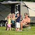 Family camping and playing with bubbles while enjoying their 2016 Sonic SN234VBH Travel Trailer - Close