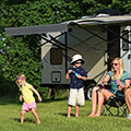 Family camping and playing with bubbles while enjoying their 2016 Sonic SN234VBH Travel Trailer - Horizontal