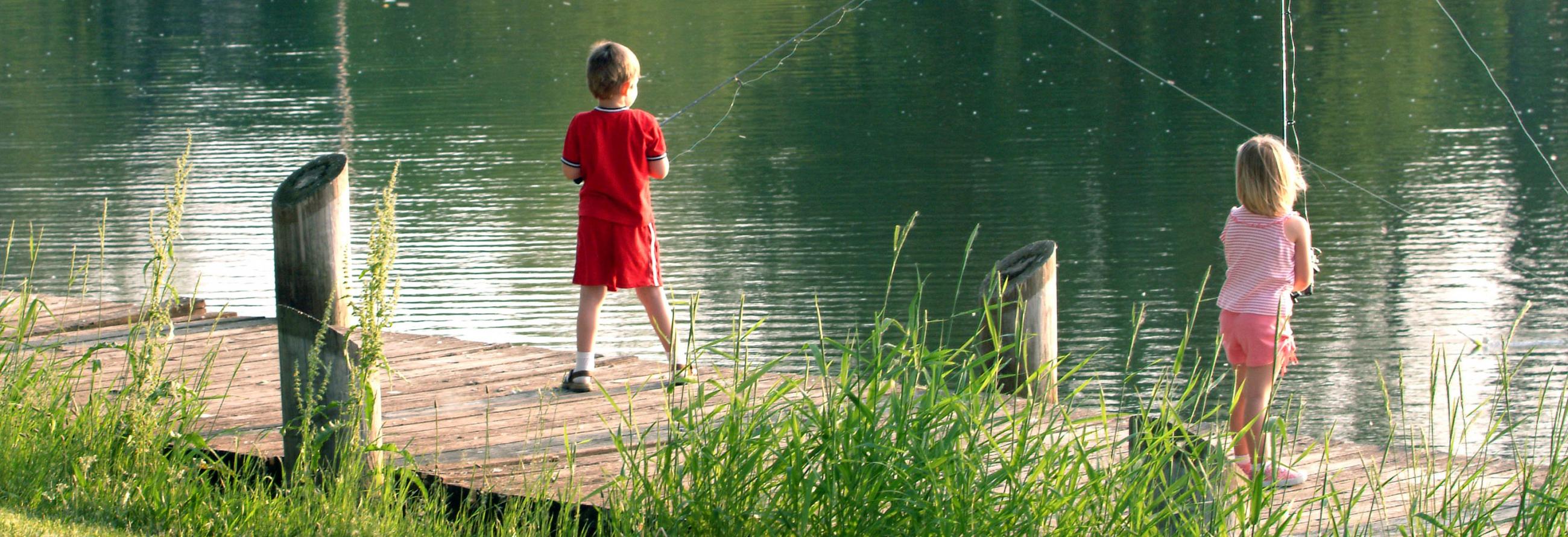 Kids enjoying fishing with their SportTrek Travel Trailer