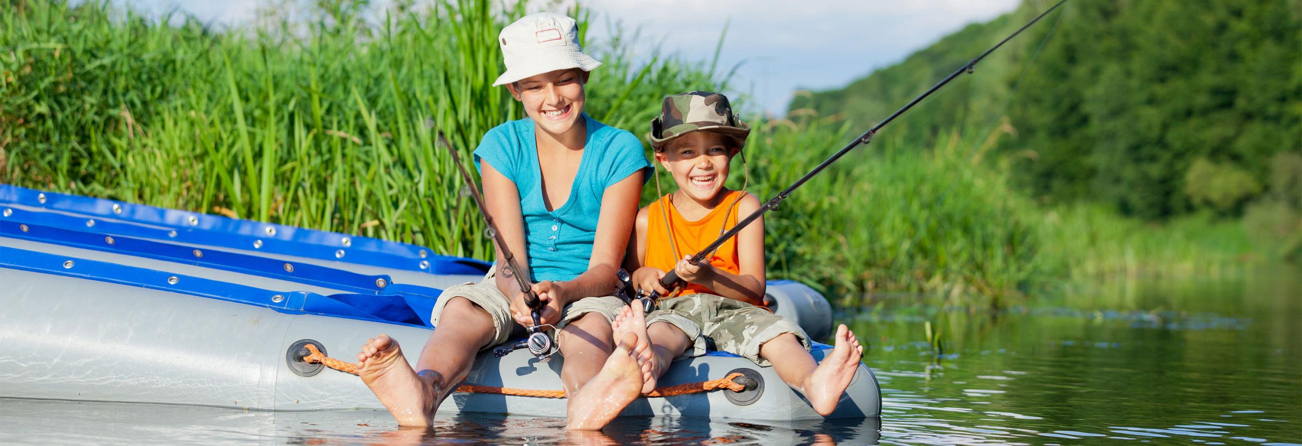 Kids enjoying fishing with their 2017 SportTrek Travel Trailer