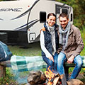 2018 Venture RV Sonic SN200VML Travel Trailer with Couple by Campfire