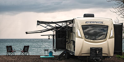 2020 Venture RV SportTrek Touring Edition STT343VIK Travel Trailer Exterior with exterior at campground with lake
