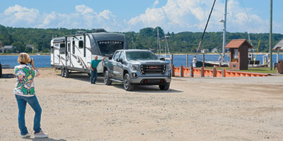 2023 Venture RV SportTrek Touring Edition STT343VIK Travel Trailer Lifestyle Couple at Boat Dock