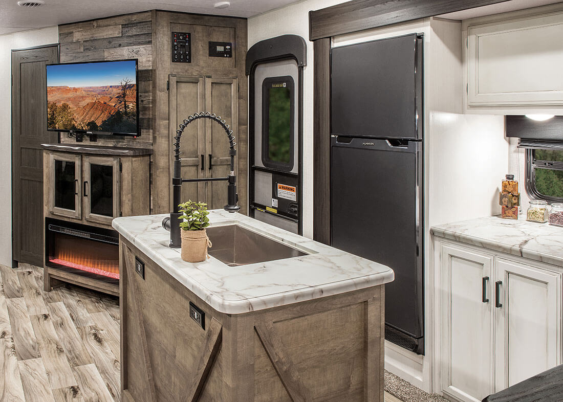 travel trailer with kitchen island and bunkhouse