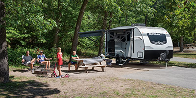 2023 Venture RV Sonic Lite SL169VUD Travel Trailer with Family at Campsite
