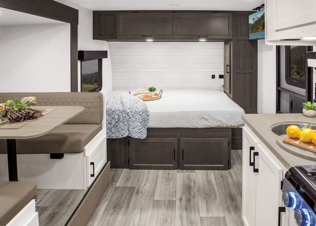 2026 Venture RV SportTrek Stinger STS222VUD Travel Trailer Kitchen and Bed