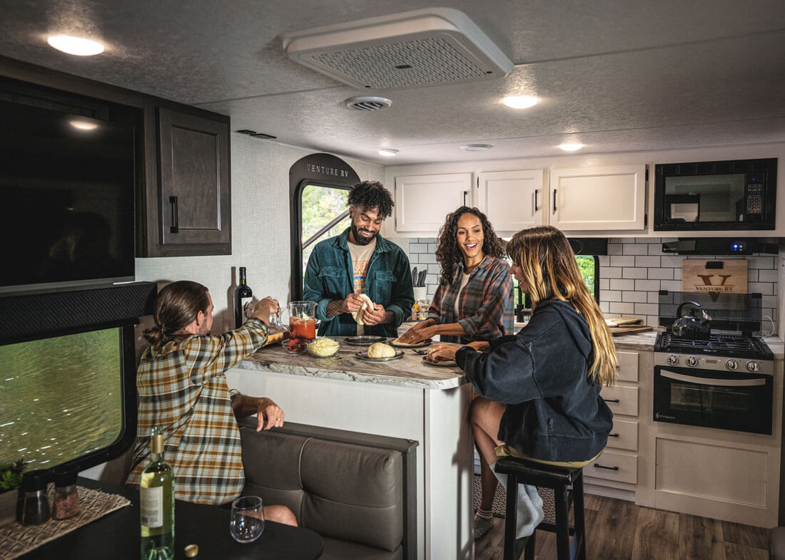 Venture RV Stratus SR241VRK Travel Trailer with Friends in Kitchen