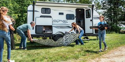 2025 Venture RV Sonic Lite SL169VUD Travel Trailer Lifestyle Exterior Set Up 2