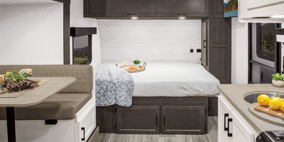 2026 Venture RV SportTrek Stinger STS222VUD Travel Trailer Kitchen and Bed