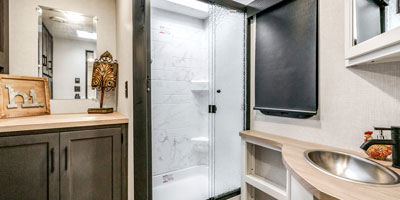 2025 Venture RV SportTrek Touring Edition STT292VRB Travel Trailer Bathroom Vanity, Double Mirror and Shower Surround