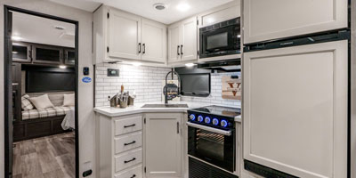 2025 Venture RV SportTrek Touring Edition STT292VRB Travel Trailer Kitchen Refrigerator, Cooktop, Microwave and Deep Basin Sink