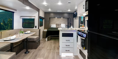 2025 Venture RV Stratus SR211VBH Travel Trailer Dinette, Bed and Kitchen