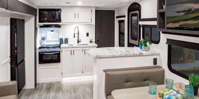 2026 Venture RV Stratus SR302VBH Travel Trailer Dinette and Kitchen